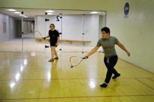 Students Jessica Jansma and Gustavo Zavala play racquetball in the Walton Lifetime Health Complex.