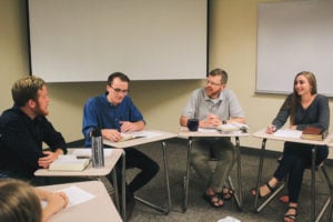 KENZIE MEEKER /TheThreefoldAdvocate Jay Bruce (right) and students learning about Scripture.