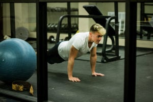 John Brown University Student Johnathan Keith does 22 push-ups a say to bring awareness to PTSD and suicide amongst veterans.